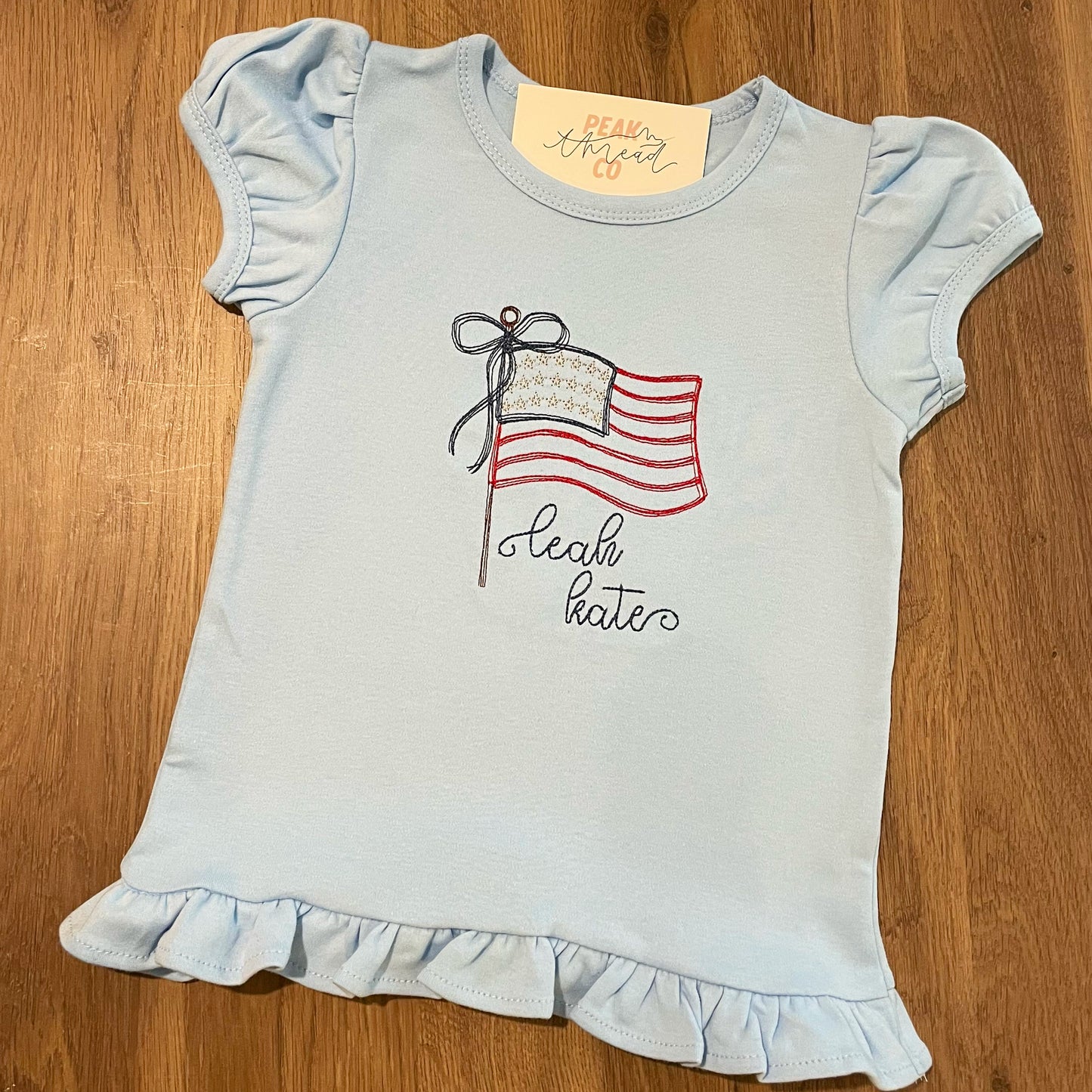 Waving Flag Tee with Bow